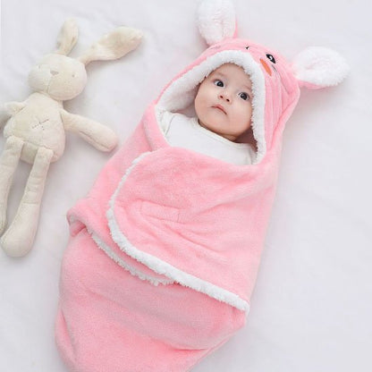 Nid d'ange rose lapin bébé au chaud bien enveloppé